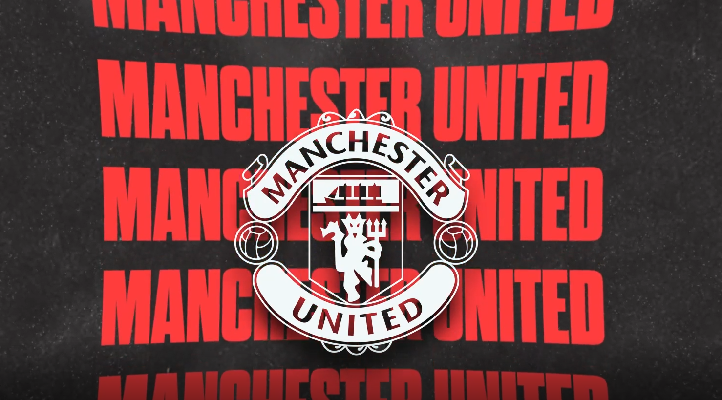 two people sitting on a ledge talking